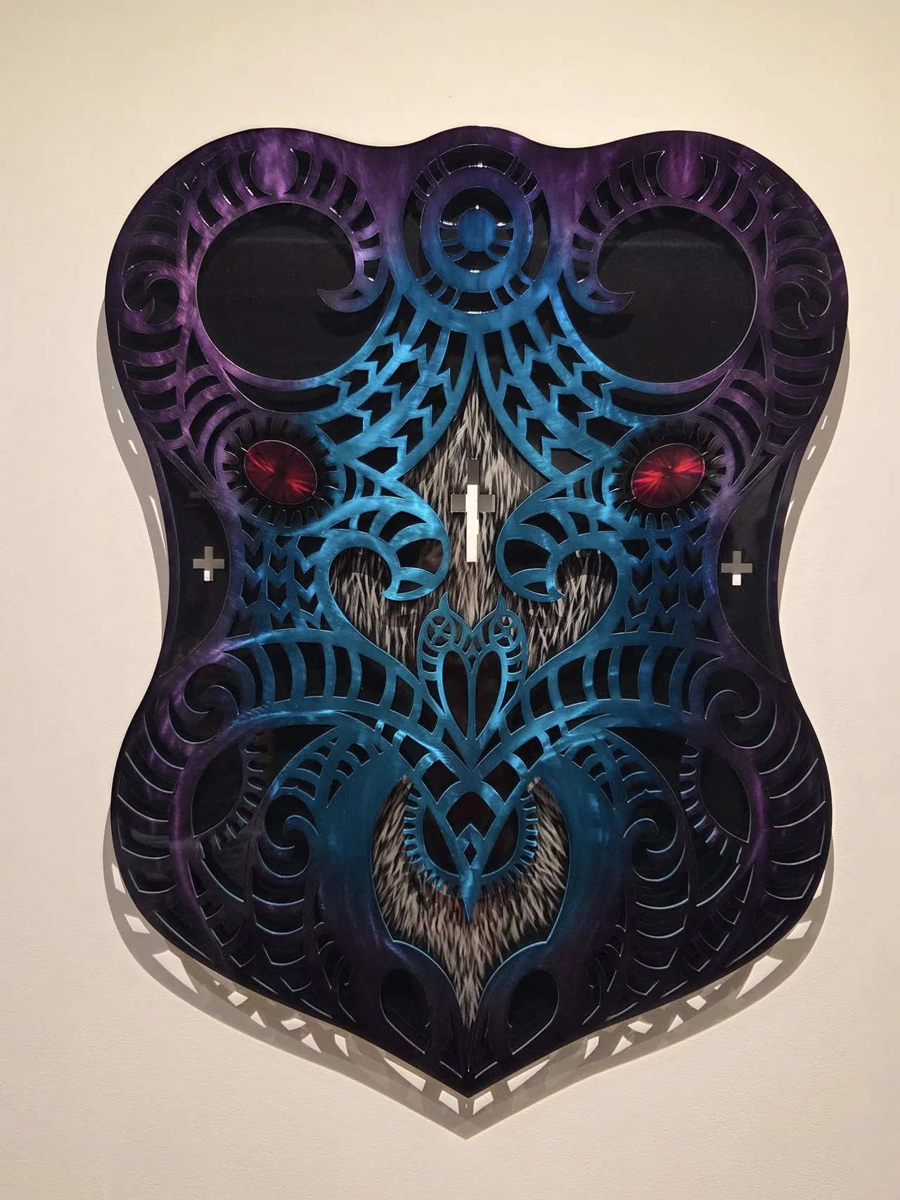 Purple and blue Maori-inspired shield artwork cut by Scott's Steelworkz