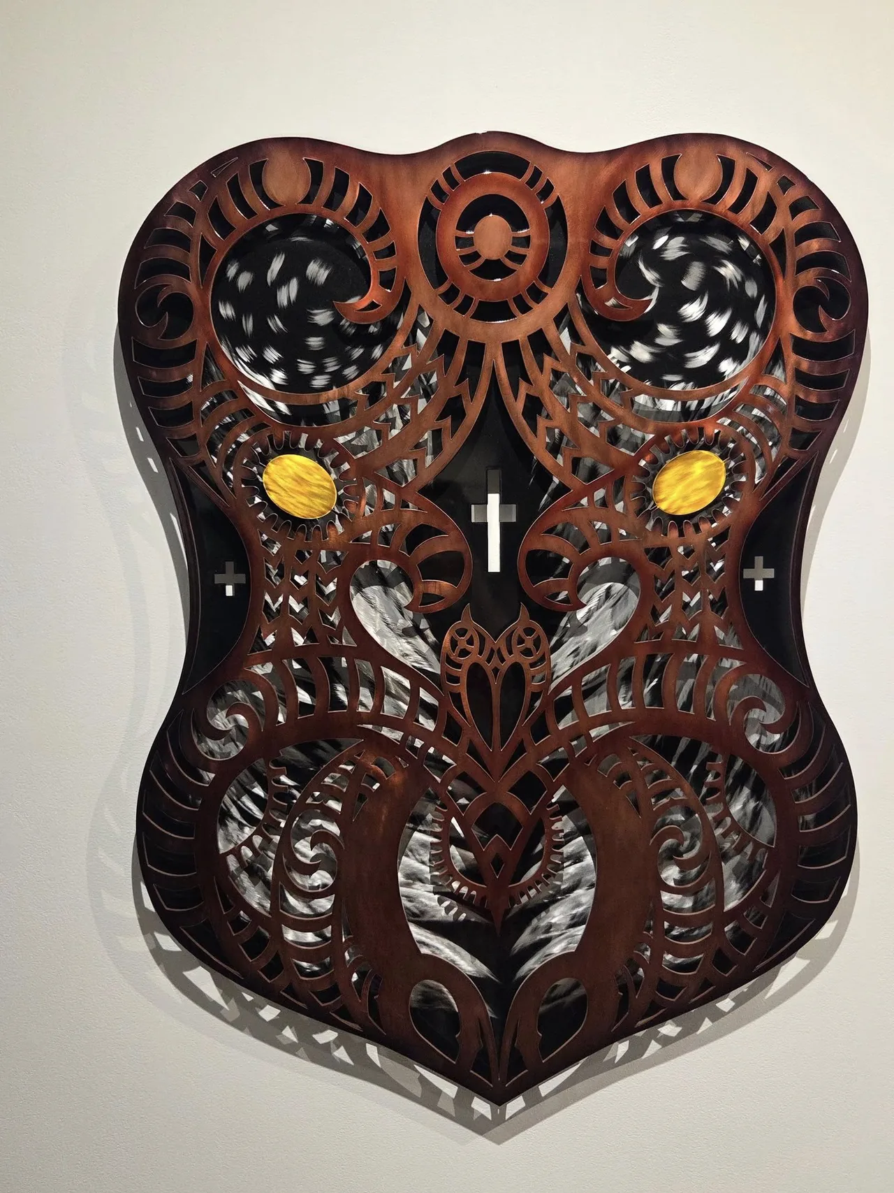Copper brown Maori-inspired shield artwork cut by Scott's Steelworkz