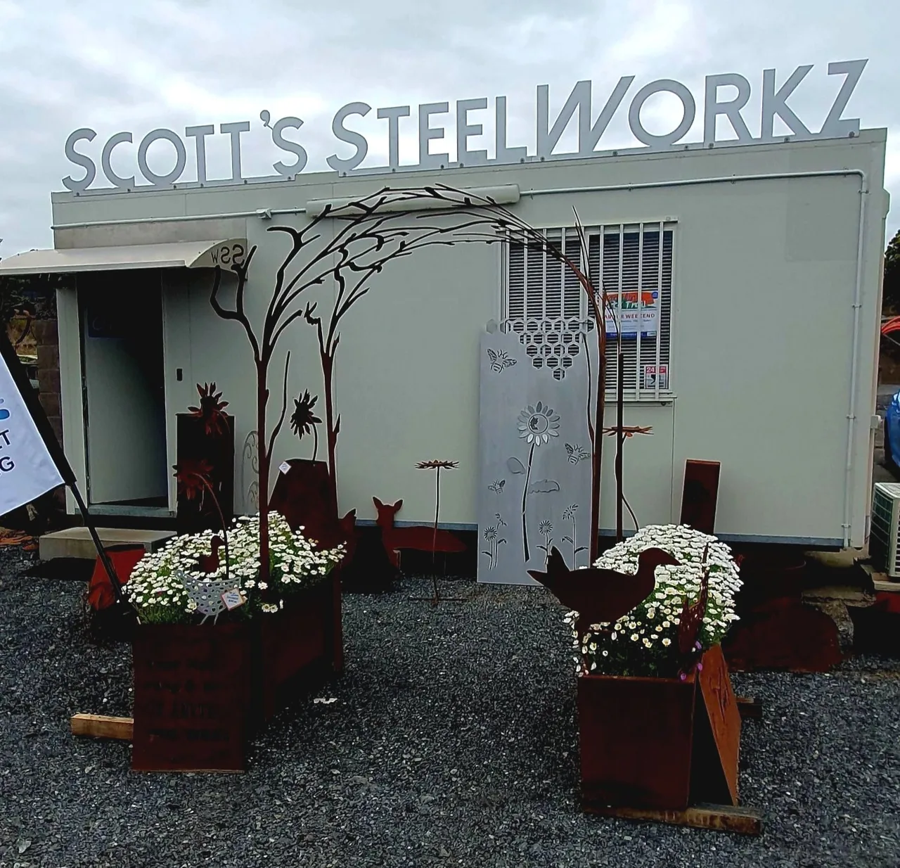 Scott's Steelworkz storefront with outdoor steel art on display